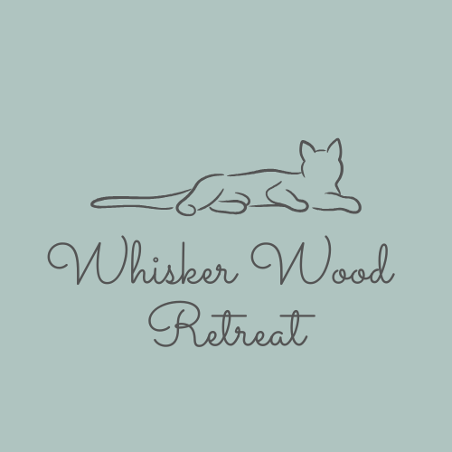 Whisker Wood Retreat logo - black silhouette of a cat laying across the business name below on a sage green background